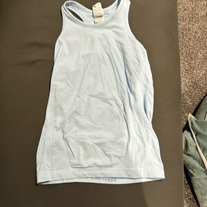 light blue Athletica tank top, worn, but in decent condition